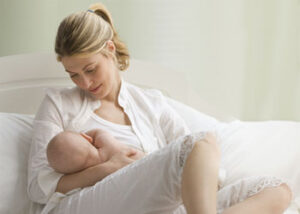 Caucasian mother breast feeding baby boy شیردهی به نوزاد